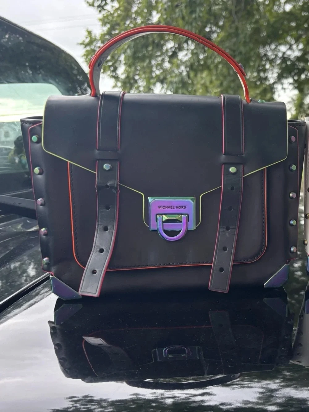 Michael Kors Black Satchel with Iridescent Hardware and Red Trim